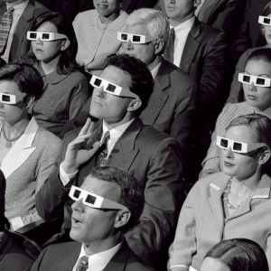 black and white image of a group of people with older style 3d glasses
